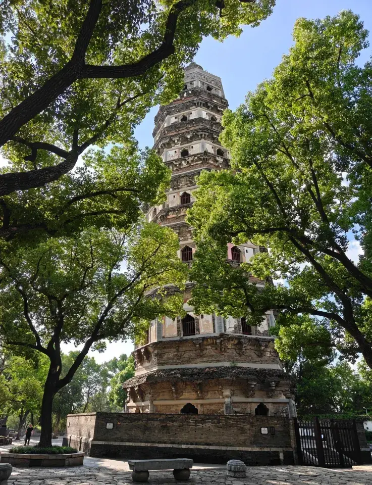 Tiger Hill's leaning pagoda seen through trees